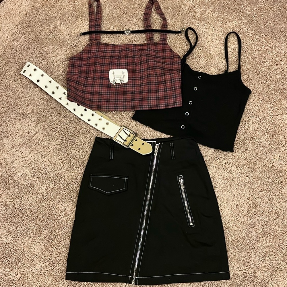 Black skirt with two sleeveless shirts white belt earrings and choker